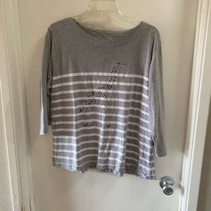 Woman’s 3/4 sleeve shirt by Salon studios.